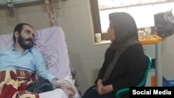 تصویری که مدیر خبرگزاری میزان، وابسته به قوه قضاییه، روز دوشنبه از حسین رونقی بر تخت بیمارستان منتشر کرد