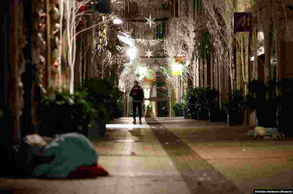 A man walks along a deserted street in Strasbourg the day after a deadly shooting in the French city on December 11. (Reuters/Christian Hartmann)