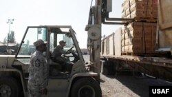 Kyrgyzstan/U.S. -- Humanitarian aid to Kyrgyz earthquake victims collected by U.S. Airbase at Manas airport in Bishkek personnel, Bishkek, 08Oct2008