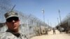 U.S. soldiers guard Camp Bucca on the outskirts of Basra.