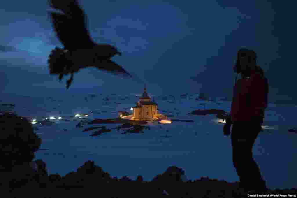 First Prize in the Daily Life Stories category was won by Australian Getty Images photographer Daniel Berehulak. This image from the series is of a Chilean scientist walking above the Russian Orthodox Church of the Holy Trinity on the Bellingshausen Russian Antarctic base. (November 28, 2015)