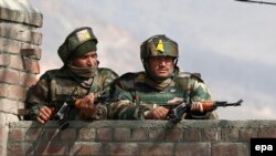 Indian soldiers take position during fighting earlier this year against Pakistani militants in Kashmir.