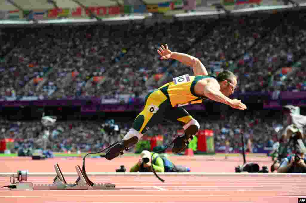 South Africa's Oscar Pistorius became the first ever double-leg amputee to compete at an Olympic Games when he raced in the 400-meter heats of the track-and-field program in August. Pistorious also took part in the Paralympics a month later, winning three medals. (AFP/Oliver Morin)