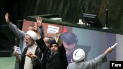 Iranian MPs opposing the bill against financing terrorism showing their disdain for the legislation.