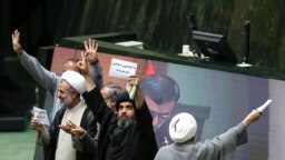 Iranian MPs opposing the bill against financing terrorism showing their disdain for the legislation.