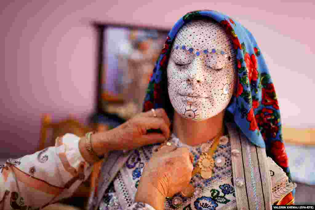 Local women help the bride, Sellma Demirovic, to get dressed in traditional clothes for a typical wedding in Donje Ljubinje,&nbsp;a predominantly ethnic Bosniak village of some 3,000 residents located in the Shar Mountains on the border between Kosovo and North Macedonia.&nbsp;