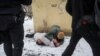 A serviceman treats a woman wounded by a Russian missile strike in the eastern Ukrainian city of Kramatorsk, on February 2.