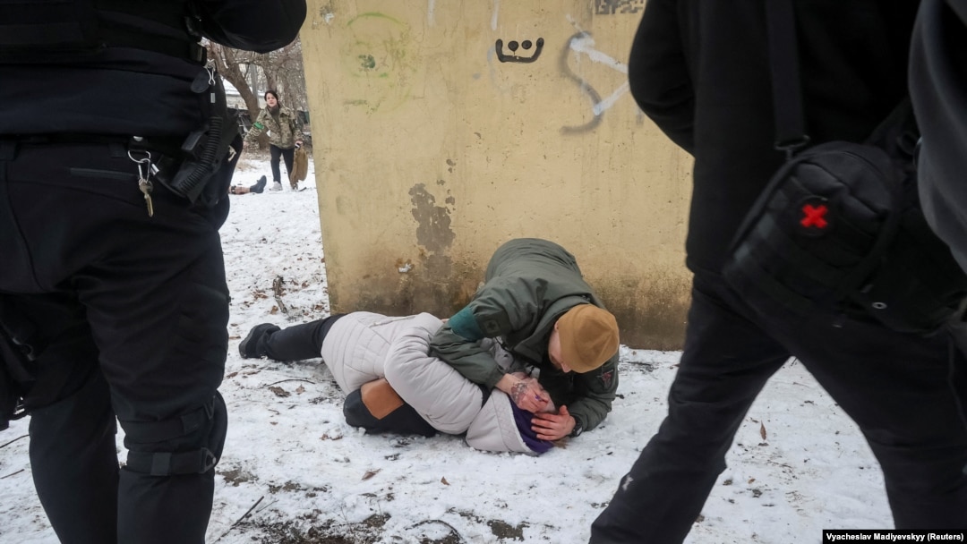A serviceman treats a woman wounded by a Russian missile strike in the eastern Ukrainian city of Kramatorsk, on February 2.