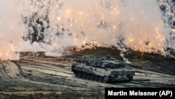 A Leopard 2 tank is seen in action during exercises at the Field Marshal Rommel Barracks in Augustdorf, Germany, on February 1.
