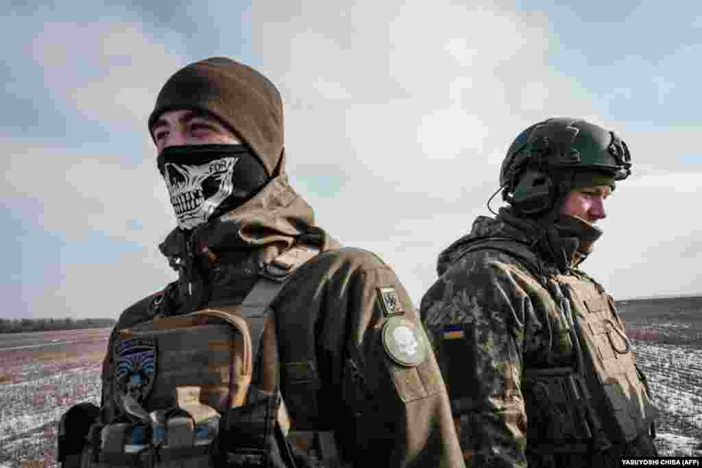 Ukrainian servicemen from an artillery unit stand near the frontline town of Bakhmut on February 7.&nbsp;