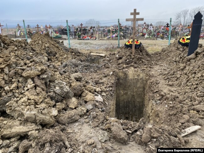 Freshly dug graves appear in the cemetery almost every day.
