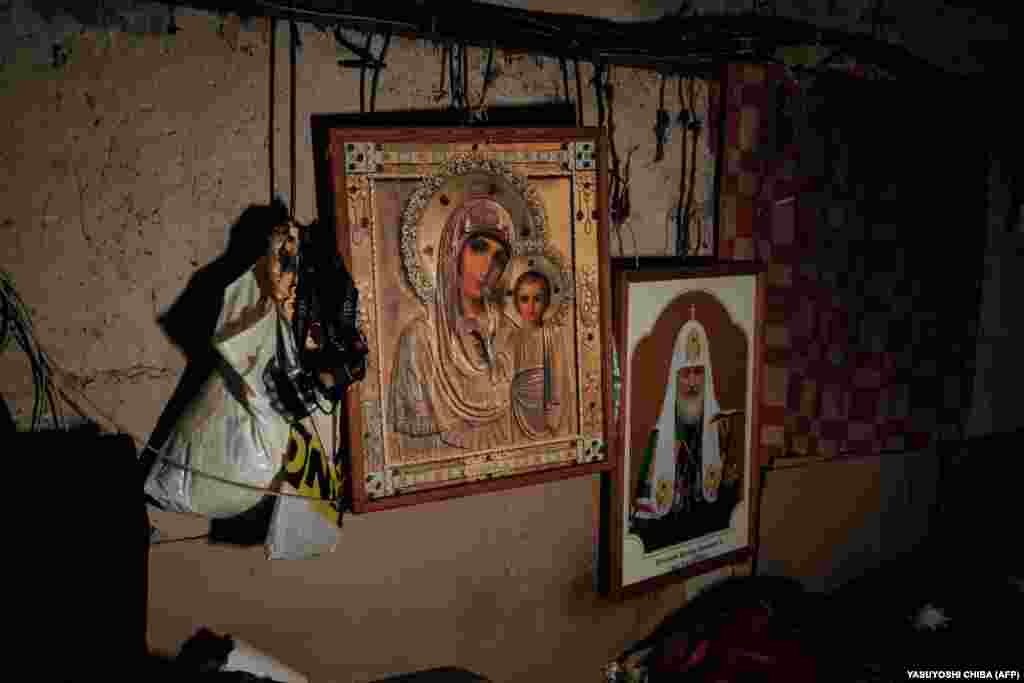 Religious icons adorn the walls of the basement they call home.