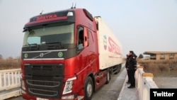 Armenia - A truck loaded with humanitarian aid crosses the Armenian-Turkish border, February 11, 2023.