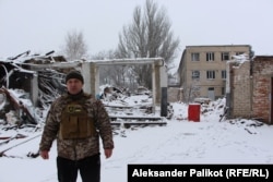 Serhiy Yarmak, mayor of the Zaporizhzhya region town of Hulyaypole, stands in front of what is left of the city council garage.
