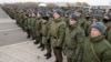 Mobilized Russian citizens line up at an assembly station in Kazan on October 23 before departing for the front lines in Ukraine.