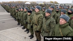 Mobilized Russian citizens line up at an assembly station in Kazan on October 23 before departing for the front lines in Ukraine.