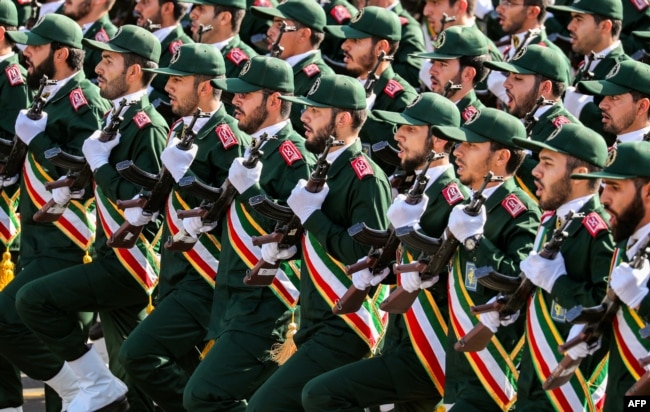 Members of Iran's Islamic Revolutionary Guards Corps march in an annual military parade in Tehran.