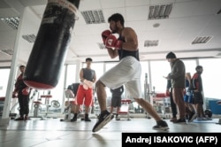 Afghan boxers train at a gym on the outskirts of Belgrade on November 26.