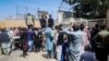 Afghans line up outside the French Embassy in Kabul on August 17 seeking visas and permission to get on a military flight to leave Afghanistan.