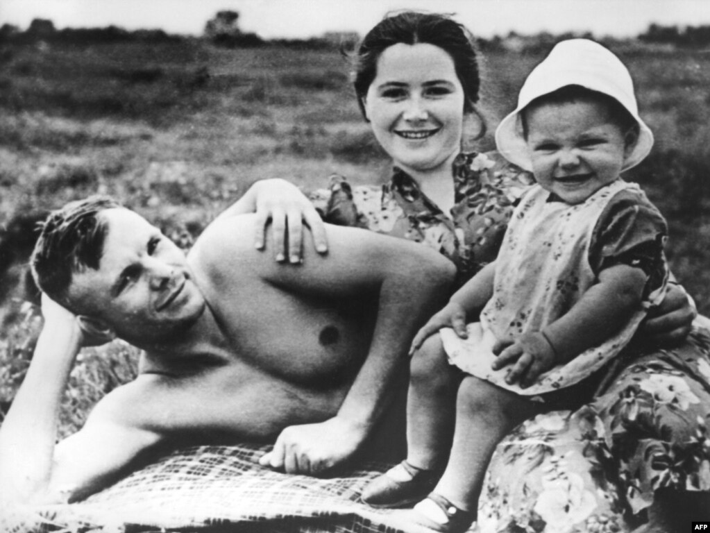 Yuri Gagarin poses on a beach with his wife, Valentina, and their daughter Yelena in June 1960, less than a year before he made history as the first person to travel into space.