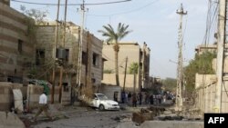 Debris litters the street outside the church the morning after the hostage crisis ended violently.