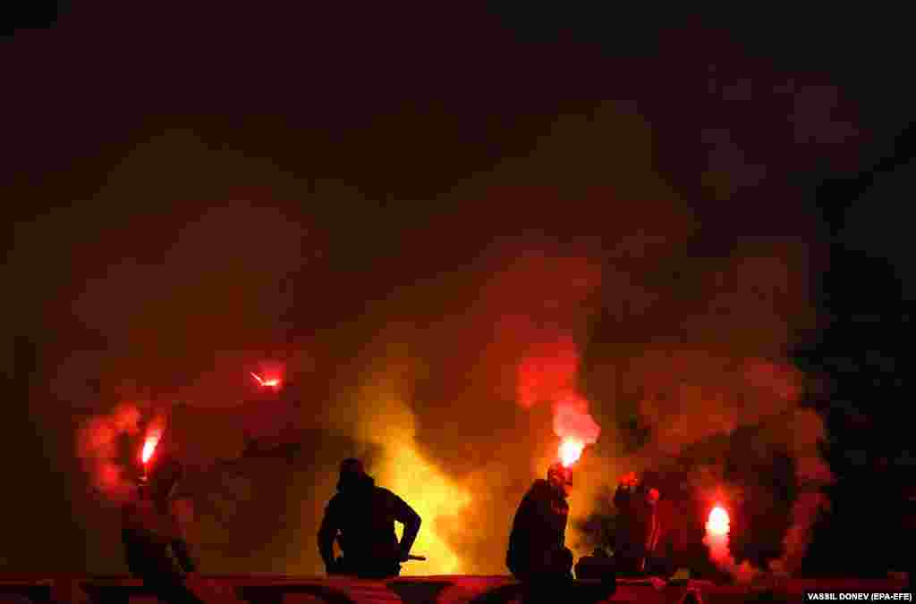 Fans of the soccer club CSKA Sofia light flares during their team&#39;s UEFA Europa Conference League game with AS Roma in the Bulgarian capital on December 9.&nbsp;