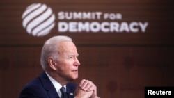 U.S. President Joe Biden convenes a virtual summit with leaders from democratic nations at the State Department's Summit for Democracy, at the White House, in Washington, U.S. December 9,