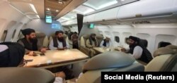 Taliban delegates pictured en route to face-to-face talks with U.S. officials in Doha in October.