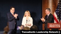 RFE/RL Ukrainian Service journalist Natalie Sedletska, receiving the Transatlantic Leadership Network’s inaugural “Freedom of the Media” award. l-r: TLN Executive Vice President Dr. Sasha Toperich, Natalie Sedletska, TLN President Dr. Daniel Hamilton.