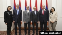 Armenia - French far-right presidential candidate Eric Zemmour (third from right) poses for a photograph with members of the Armenian parliament, Yerevan, December 13, 2021.