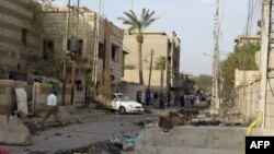 Debris litters the street outside the Syrian Catholic Church the morning after the deadly October 2010 attack.