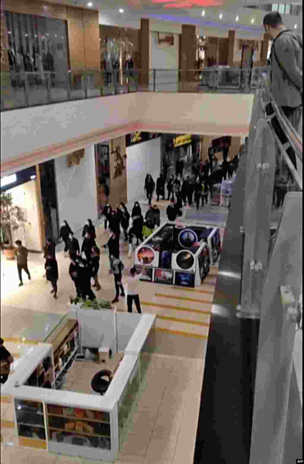 Protesters chant slogans as they walk through a shopping mall in the central city of Isfahan on November 15.&nbsp; As well as Tehran and Isfahan, stores were reportedly closed in Iran&#39;s western Kurdish region on November 15.