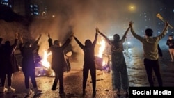 Iranian youths protest against the government in the western city of Sanandaj on November 16. 