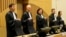 Presiding Judge Hendrik Steenhuis (second from left) stands before the verdict session of the Malaysia Airlines Flight 17 trial at the high-security court at Schiphol Airport, near Amsterdam, on November 17.