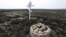 Toys are placed near a cross in memory of victims of the Malaysia Airlines Flight 17 plane crash in the village of Rozsypne in Ukraine's eastern Donetsk region in March 2020.