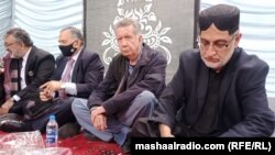 Sardar Akhtar Mengal (right) and others gather at a 2022 meeting in Quetta with family members of missing Baluch.