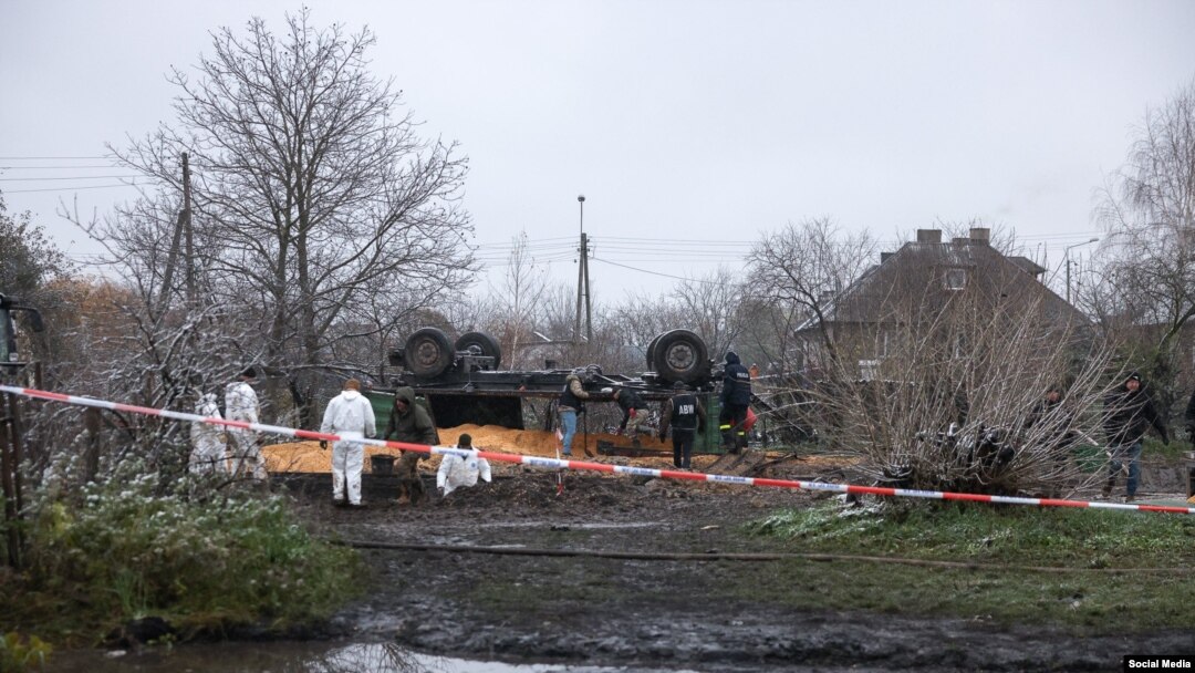 Polish investigators work at the site where a missile struck a grain facility in the village of Przewodow last November. (file photo)