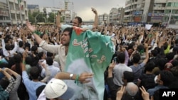 Musavi supporters rally in Tehran, the first time a defeated candidate has refused to accept defeat in Iran.