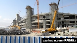 A new stadium under construction in Ashgabat -- but does the government still have the money for such extravagances?