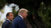 French President Emmanuel Macron welcomes U.S. President Donald Trump at the G7 summit, August 24, 2019.