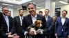 U.S. Secretary of State Antony Blinken holds a mine-detection dog during a visit to the children's hospital in Kyiv on September 8.