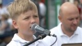 Eight-year-old Yuriy sings in Lviv to raise money for the army