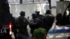 Police special forces enter the Iranian Embassy in Tirana on September 8 as Albania cuts ties with Iran and orders diplomats to leave over a recent cyberattack.