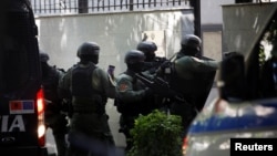 Police special forces enter the Iranian Embassy in Tirana on September 8 as Albania cuts ties with Iran and orders diplomats to leave over a recent cyberattack.
