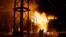 Ukrainian emergency workers put out a fire after a Russian rocket attack on an electric power station in Kharkiv on September 11. 
