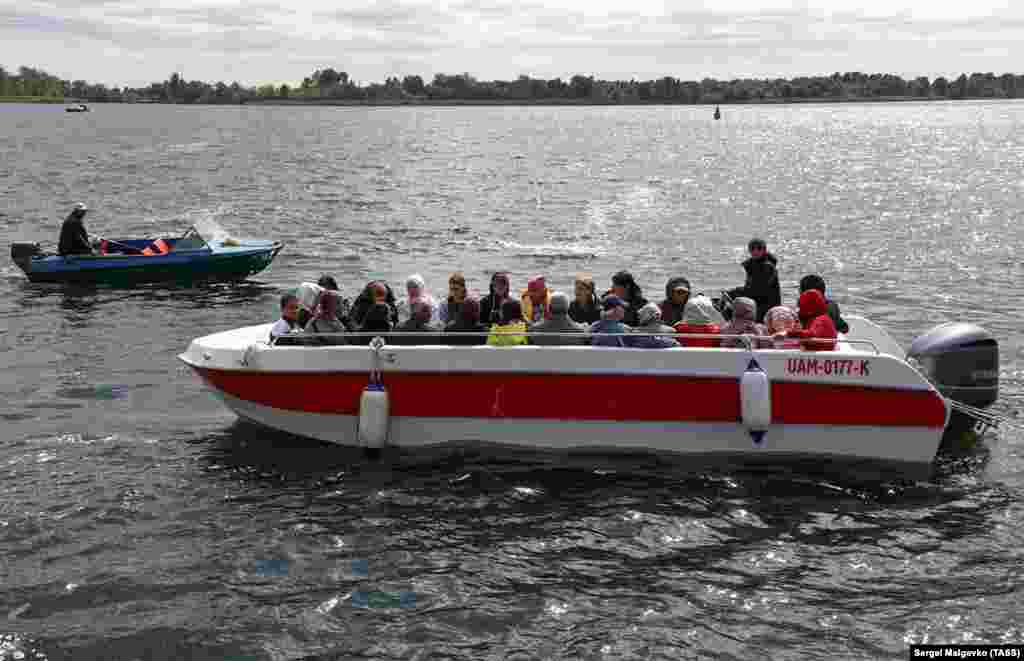 This boat looks like a tourist vessel, but it is packed with residents of Kherson wanting to cross the Dnieper River on September 8.