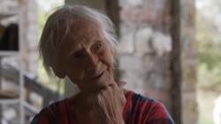 Ukrainian Librarian, 81, Salvages Books From Ruined School As New Academic Year Begins