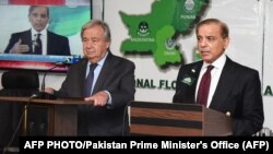 Speaking on November 7 at the COP27 climate conference alongside UN Secretary-General Antonio Guterres (left), Prime Minister Shehbaz Sharif (right) said Pakistan's escalating public debt was hampering its recovery. (file photo)