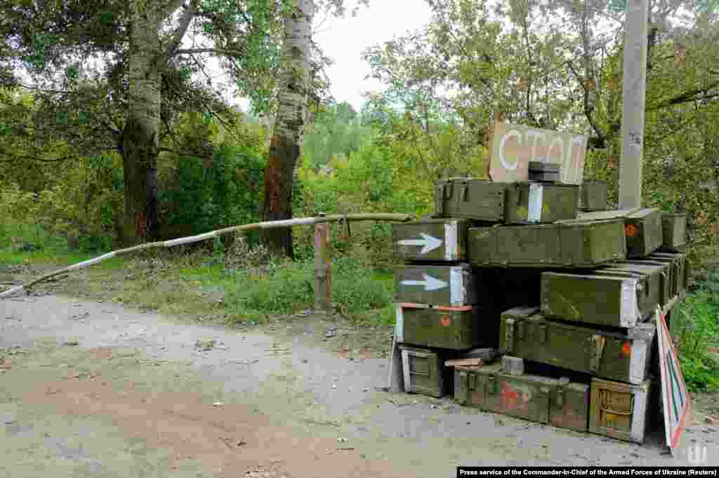 An abandoned Russian checkpoint made from ammunition boxes and a tree in the Kharkiv region. On September 12, Britain&#39;s Defense Ministry said in a report that the lightning Ukrainian advance that has retaken several towns key to Russia&#39;s invasion logistics has &quot;significant implications for Russia&#39;s overall operational design.&quot;