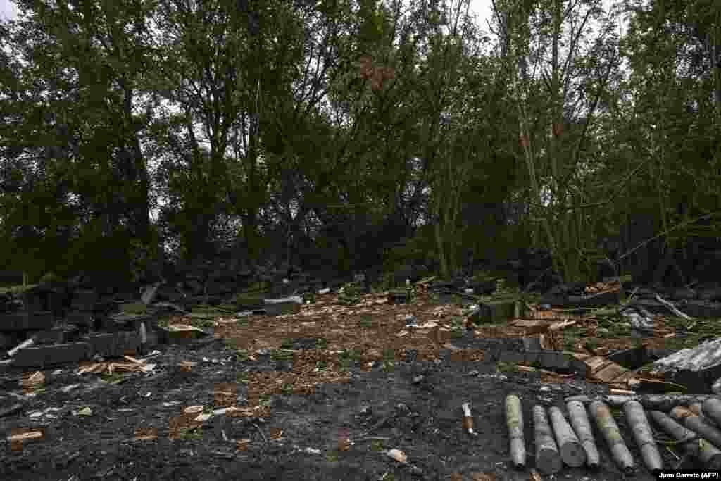 An abandoned Russian position in Balaklia on September 10. Still-packaged rocket-propelled grenades can be seen among discarded ammunition boxes and artillery shells.&nbsp;